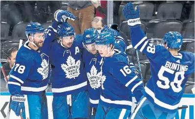  ?? RICHARD LAUTENS TORONTO STAR ?? Auston Matthews, second from left, scored 21 seconds into Thursday’s game against the Pittsburgh Penguins.