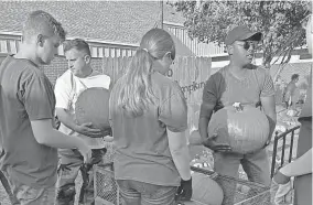  ?? PROVIDED ?? St. Matthews United Methodist Church members unload pumpkins in preparatio­n for the house of worship’s 2021 Pumpkin Patch, open through Oct. 31 at 300 N. Air Depot Blvd. in Midwest City.