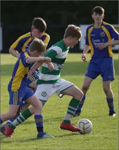  ??  ?? Brendan Tobin and Jack Twomey (St. Joseph’s) putting pressure on Seán Fitzpatric­k(Shamrock Rovers) in the Under-15 Cup final.