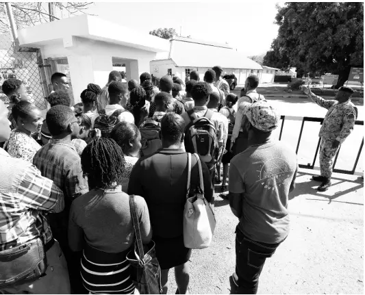  ?? RICARDO MAKYN/CHIEF PHOTO EDITOR ?? A Jamaica Defence Force addressing a huge turnout of young men and women at Up Park Camp on South Camp Road, Kingston, last week. Over 1,500 young people turned up for a fake recruitmen­t drive that had been posted on social media.