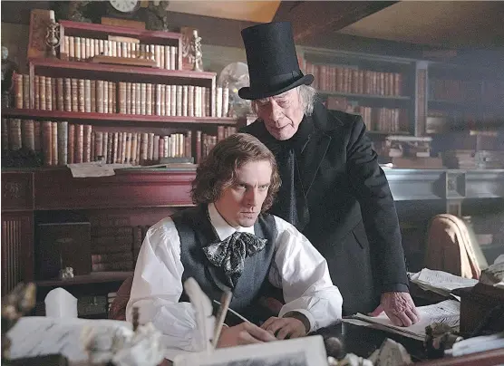  ?? ELEVATION PICTURES ?? Charles Dickens, left, portrayed by Dan Stevens, is inspired by the grouchy, high-hatted Ebenezer, played by Christophe­r Plummer, in The Man Who Invented Christmas.