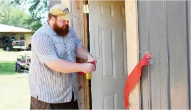  ??  ?? (Top) Sturgis’ resident gunsmith Zac Borthwick cuts the ribbon for the grand opening of Borthwick Ballistics.