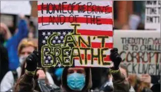  ??  ?? A sign held aloft during a Black Lives Matter protest in Dublin.