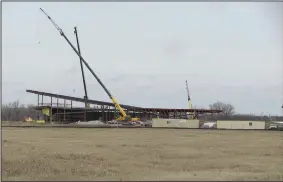  ?? Arkansas Democrat-Gazette/DAVE HUGHES ?? Constructi­on crews work Thursday on the steel framing of the 50,000-square-foot U.S. Marshals Museum in Fort Smith. Officials have pushed back the opening date of the museum until next year.