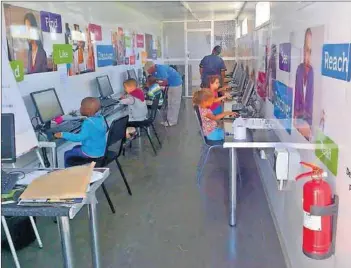  ?? Photo: Supplied ?? Little learners: Children use computers in a solar-powered EcoClass.