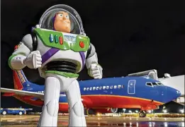 ?? COURTESY OF JASON WILLIAM HAMM ?? Jason William Hamm, a Southwest Airlines ramp agent, took photos of Buzz Lightyear on the tarmac and around the plane to chronicle the lost action figure’s adventure for Hagen Davis.