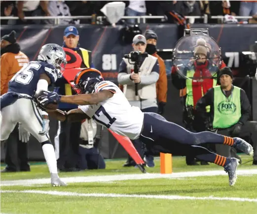  ?? CHARLES REX ARBOGAST/AP ?? Bears receiver Anthony Miller dives across the goal line for a touchdown in the third quarter Thursday against the Cowboys.