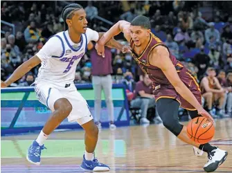  ?? NAM Y. HUH/AP ?? Krutwig says he is glad to see Loyola guard and former teammate Lucas Williamson (right, driving against DePaul) taking on more of the scoring load for the Ramblers this season.