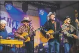  ?? NATHAN BURTON/Taos News ?? Michael Hearne and Friends perform during the 20th anniversar­y of the Big Barn Dance.