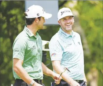  ?? LM OTERO/AP ?? TAYLOR PENDRITH (right) laughs with fellow competitor Davis Riley (left) at the second hole tee box during the third round of the Byron Nelson golf tournament in Mckinney, Texas, on Saturday.