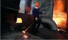  ?? XINHUA ?? An employee works at an iron and steel plant in Zhangzhou, Fujian province, on Monday.