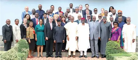  ?? PHOTO: PHILIP OJISUA ?? President Muhammadu Buhari (fifth right); his deputy, Prof. Yemi Osinbajo (seventh left); Nigeria’s Ambassador to Germany, Yusuf Tuggar (right); Chief of Staff to the President, Abba Kyari (fifth right); CEO, Siemens, Joe Kaeser (sixth left); Deputy Head of Mission, German Embassy, Regina Hess (third left); and others after the official singing of the implementa­tion agreement of the Nigerian Electrific­ation Roadmap at the State House, Abuja…yesterday.