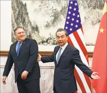  ?? Andy Wong Pool Photo ?? CHINESE FOREIGN MINISTER Wang Yi, right, was unusually edgy during an appearance with U.S. Secretary of State Michael R. Pompeo in Beijing. Pompeo responded to Wang with equal bluntness.