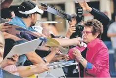  ??  ?? Billie Jean King signs autographs at the premiere for ‘Battle of the Sexes’ in Los Angeles in this Sept 16, 2017. — Reuters file photo