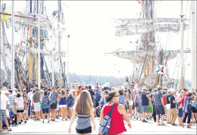  ?? CHRISTIAN ROACH/CAPE BRETON POST ?? Large crowds turned out on the Lousbourg waterfront on Friday to see the Tall Ships docked at the wharf.