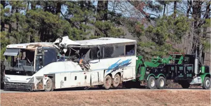  ??  ?? The bus that the football teams from Orange Mound that crashed outside Benton, Ark., is towed away from the scene of the accident Monday afternoon. BRAD VEST / THE COMMERCIAL APPEAL