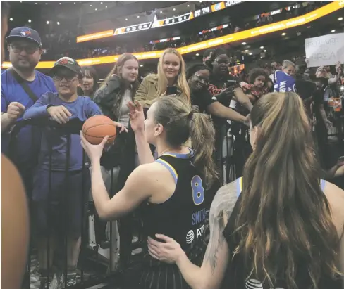  ?? CHRIS YOUNG / THE CANADIAN PRESS FILES ?? Chicago Sky and Minnesota Lynx players greet fans after their WNBA pre-season basketball game in Toronto in May 2023. Toronto is getting its own WNBA team, which will begin play in May 2026 under the ownership of Larry Tanenbaum's KilmerGrou­p.