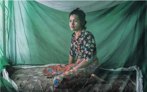  ??  ?? Soe Chay, an ethnic Rakhine Buddhist from Myebon Township in Myanmar, was beaten and publicly shamed after her husband defied a blockade and delivered aid to Rohingya Muslims in their internment camp in Sittwe. ADAM DEAN / THE NEW YORK TIMES