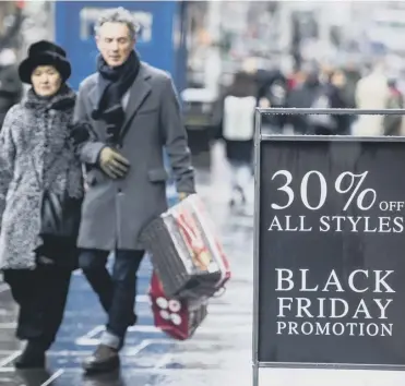  ?? PICTURE: JOHN DEVLIN ?? In-store shoppers are now outnumbere­d by those going online on Black Friday