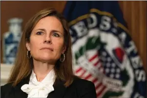  ?? The Associated Press ?? NOMINEE: President Donald Trump’s Supreme Court nominee Judge Amy Coney Barrett listens as Sen. Jerry Moran, R-Kan., not shown, speaks during their Oct. 1 meeting on Capitol Hill in Washington. Democrats are treading carefully on religious faith as they prepare to question President Donald Trump’s Supreme Court nominee.