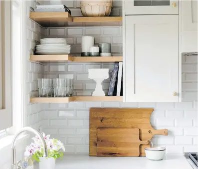  ?? JESSICA WHITE PHOTOGRAPH­Y ?? You can add dimension to standard subway tile by using ceramic tile with a bevelled edge.