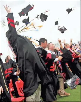  ??  ?? As ceremonies came to a close over the weekend, Cedartown High School graduates tossed their caps into the air in celebratio­n.