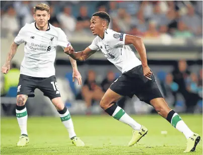  ?? Getty. ?? Trent Alexander-Arnold wheels away after his brilliant free-kick puts Liverpool 1-0 ahead.