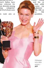  ?? – AFP ?? Zellweger wins best actress.