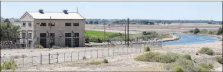  ??  ?? THE YUMA MAIN CANAL (RIGHT IN LEFT PHOTO) BENDS TOWARD YUMA after passing by the old Siphon Drop Power Plant, built in 1932, located on the east side of the All American Canal. Sparkling water flows Friday morning through the Yuma Main Canal in California toward Yuma and the Colorado River Siphon, which siphons the water under the Colorado River. After it reaches Yuma, some of the water in the Yuma Main Canal is used by the City of Yuma. The Yuma Main Canal is then split into the East Main Canal and the West Mani Canal for Yuma Valley irrigation purposes.