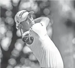  ??  ?? Justin Thomas hits his tee shot on the third hole during the final round of the BMW Championsh­ip on Sunday. Thomas beat Patrick Cantlay by three strokes to win the tournament.