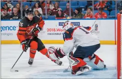  ?? CP PHOTO MARK BLINCH ?? Canada’s Jordan Kyrou goes to the net against Slovakia goalie David Hrenak during the third period of IIHF World Junior Championsh­ip preliminar­y round hockey action in Buffalo, N.Y. Wednesday.