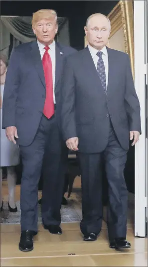  ?? PICTURE: PABLO MARTINEZ MONSIVAIS. ?? US president Donald Trump, left, and Russian president Vladimir Putin arrive for a one-onone-meeting at the Presidenti­al Palace in Helsinki yesterday. COME TOGETHER: