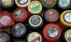  ??  ?? Individual­ly wrapped cheeses from the Cheshire Cheese Company, which has been left with a £250,000 hole in its finances. Photograph: Phil Noble/Reuters