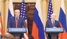  ?? CHRIS RATCLIFFE/BLOOMBERG ?? President Donald Trump listens as Vladimir Putin speaks during a news conference in Helsinki, Finland, on July 16.