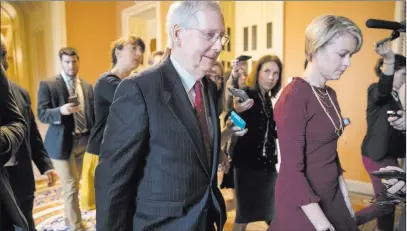  ?? J. Scott Applewhite ?? The Associated Press Senate Majority Leader Mitch Mcconnell, R-KY., returns to his office after speaking Monday on the Senate floor about Supreme Court nominee Brett Kavanaugh.