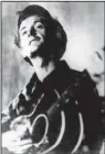  ?? Democrat-gazette file photo ?? An undated photo of singersong­writer Woody Guthrie