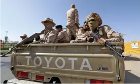  ?? Photograph: Mahmud Turkia/AFP/Getty Images ?? Forces loyal to Abdul Hamid Dbeibah in Tripoli on Tuesday following the withdrawal of fighters backing Fathi Bashagha.