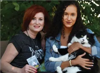  ?? BARRY GRAY, THE HAMILTON SPECTATOR ?? Shelley Morley and daughter Chloe, 18, with their cat Jude. Shelley gave Paul McCartney a manicure before his concert in Hamilton Thursday.