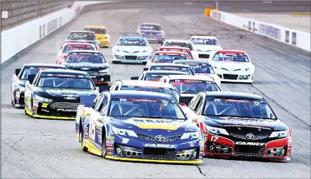  ?? (AFP) ?? Chase Purdy, driver of the #17 Bama Buggies/Textron Off Road, and Todd Gilliland, driver of the #16 NAPA Auto Parts Toyota, lead the field during the
NASCAR K&N Pro Series East United Site Services 70 at New Hampshire Motor Speedway on July 15, in...