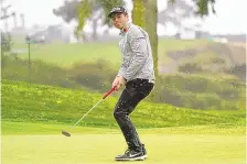  ?? GREGORY BULL/ASSOCIATED PRESS ?? Viktor Hovland of Norway reacts to a putt on the eighth hole of the South Course at Torrey Pines on Friday afternoon. He holds a oneshot lead in the PGA event.