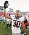  ?? THE CANADIAN PRESS FILE PHOTO ?? Chuba Hubbard, pictured, was critical of Oklahoma State coach Mike Gundy for wearing a T-shirt with the logo of a far-right media outlet.