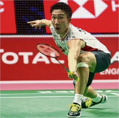  ?? — AP ?? Stunning form: Kento Momota of Japan in action against Viktor Axelsen of Denmark in the first singles of the semi-finals on Friday. Momota won 21-17, 21-9 to set up Japan’s 3-2 win.