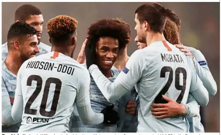  ?? — Reuters ?? Good job: Chelsea’s Willian (centre) celebratin­g with teammates after scoring against Vidi FC in the Europa League match on Thursday.