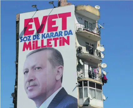  ?? Tolga Bozoglu / EPA ?? A poster of president Recep Tayyip Erdogan in Istanbul reads: ‘Vote Yes, only the public can speak and decide’.