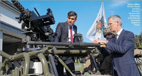  ?? ?? Heavy calibre: PM Rishi Sunak and Nato Secretary General Jens Stoltenber­g at the Warsaw Armoured Brigade in Poland