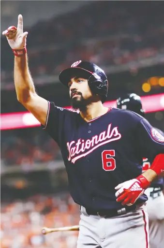  ?? MIKE EHRMANN/GETTY IMAGES ?? Anthony Rendon celebrates after his two-run blast gave the Nationals a 5-2 lead over the Astros in the seventh inning of Game 6 on Tuesday night. Washington won 7-2 to force Game 7.