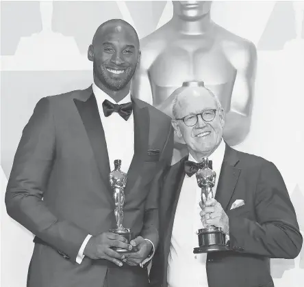  ?? DAN MACMEDAN/ USA TODAY ?? Kobe Bryant, left, and Glen Keane, won the Oscar for best animated short for “Dear Basketball” at the 90th Academy Awards in 2018.