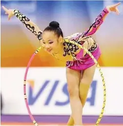 ??  ?? Poetry in motion: Wong Poh San, 16, garnered a bronze in the individual all-around event in the Deruigina Cup in Kiev, Ukraine.