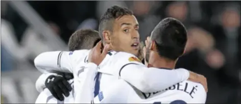  ?? AP Photo ?? Tottenham Hotspur’s Nacer Chadli, center, celebrates his goal against Anzhi.