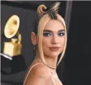  ?? Jordan Strauss / Invision ?? Dua Lipa gives Olivia NewtonJohn a nod in “Physical.”